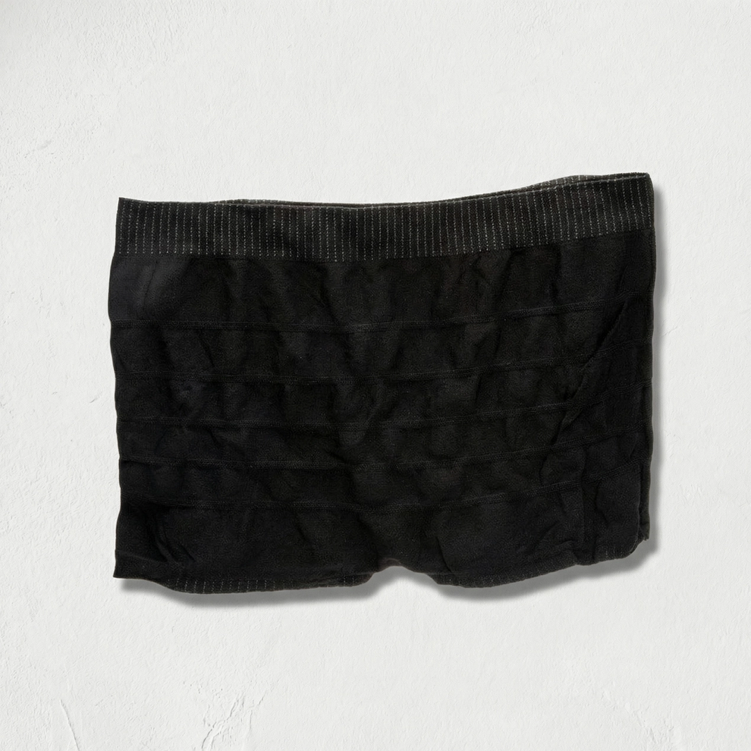 Black mesh boxer briefs on a light gray background. Available at Luca Essentials in Los Angeles. 