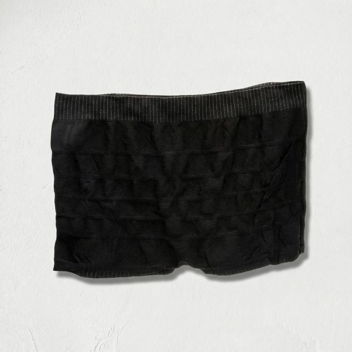 Black mesh boxer briefs on a light gray background. Available at Luca Essentials in Los Angeles. 