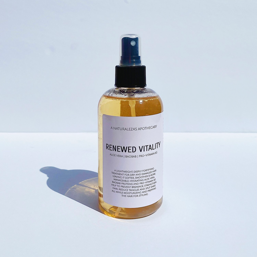 Bottle of amber colored product with 'Renewed Vitality' packaging on a white background. Available at Luca Essentials in Los Angeles. 