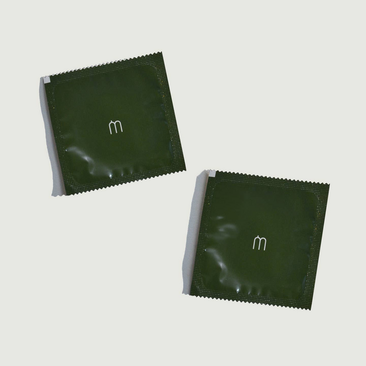 Two green packages with a white m on the outside. 

Maude large ultra-thin condoms are made without harmful chemicals, do not contain spermicide and are fragrance-free.

Available at Luca Essentials in Los Angeles. 