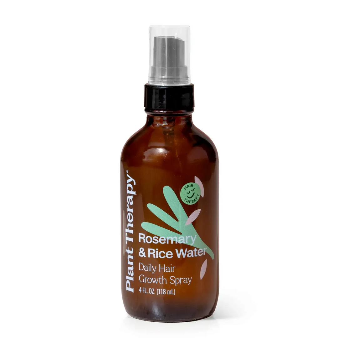 Brown glass bottle of Plant Therapy Rosemary & Rice Water Daily Hair Growth Spray with a green leaf-like illustration on a white background. Available at Luca Essentials in Los Angeles. 