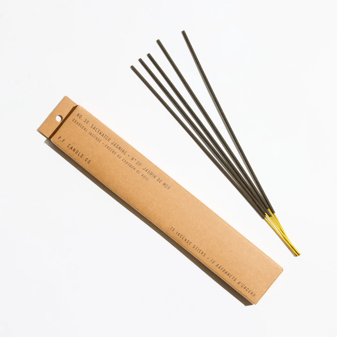 Incense sticks with a cardboard packaging on a white background. Available at Luca Essentials in Los Angeles. 