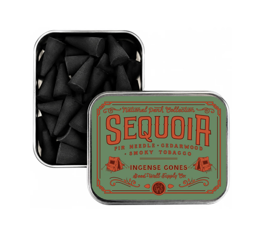 A square metal tin of Sequoia incense cones, with one tin open to show the black incense cones inside and the other closed, displaying a vintage-style green and orange label. Available at Luca Essentials in Los Angeles. 