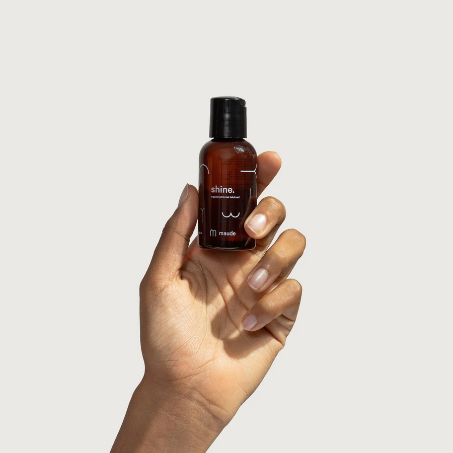 Hand holding an amber colored bottle of shine lubricant on a white background.

Formulated with organic aloe and purified water, shine delivers long-lasting glide while supporting the body’s natural moisture. 

Available at Luca Essentials in Los Angeles. 